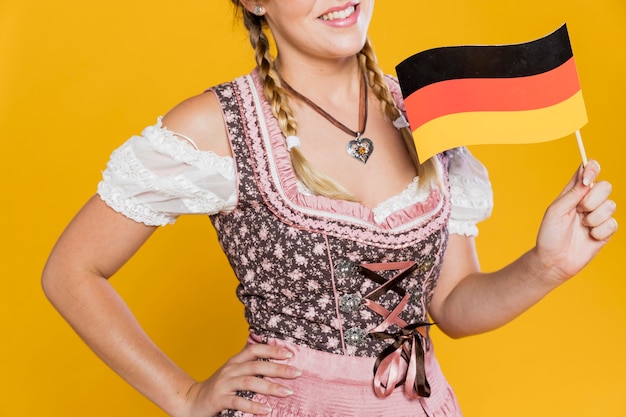Free photo gorgeous young girl with german flag