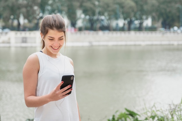 Gorgeous young woman checking her phone