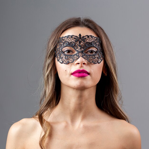 Gorgeous young woman with mask