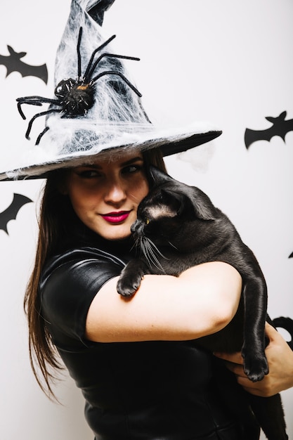 Free photo gothic woman with black cat