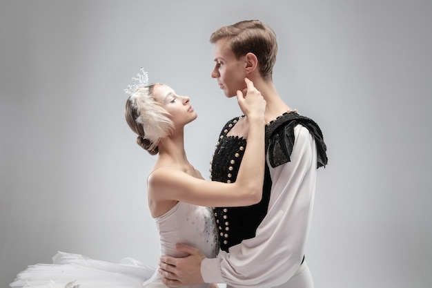 Graceful classic ballet dancers dancing isolated on white  background.