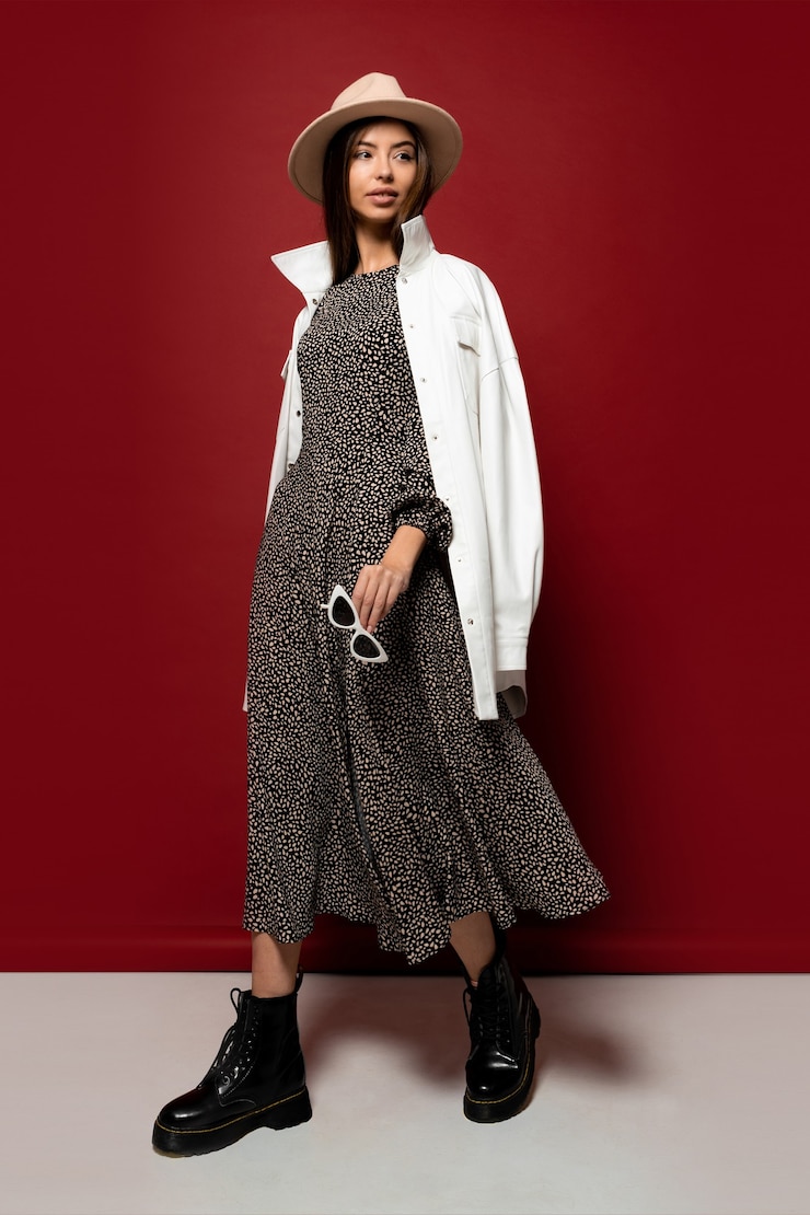 Free Photo graceful fashion model in trendy hat and autumn white jacket posing.