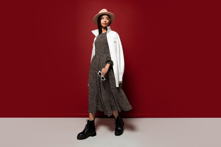 Free Photo graceful fashion model in trendy hat and autumn white jacket posing.