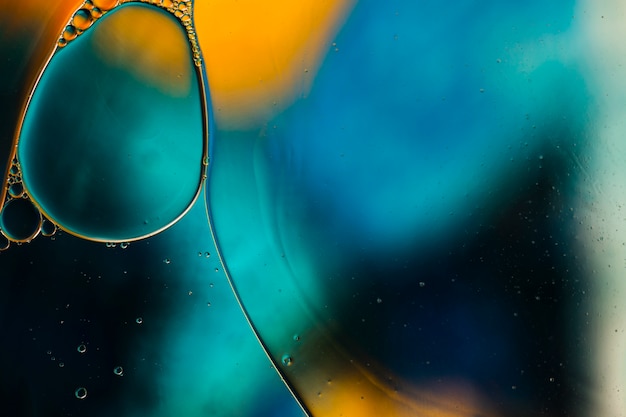 Gradient colour abstraction accompanied by transparent fluid bubbles