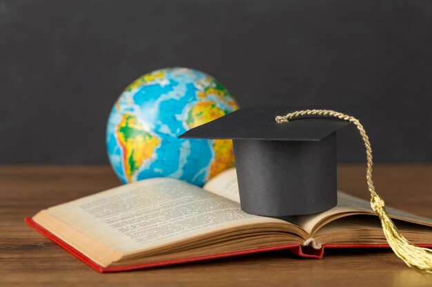 Graduation cap and earth globe arrangement