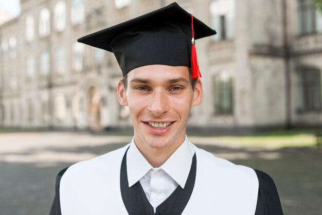 Graduation concept with portrait of happy man