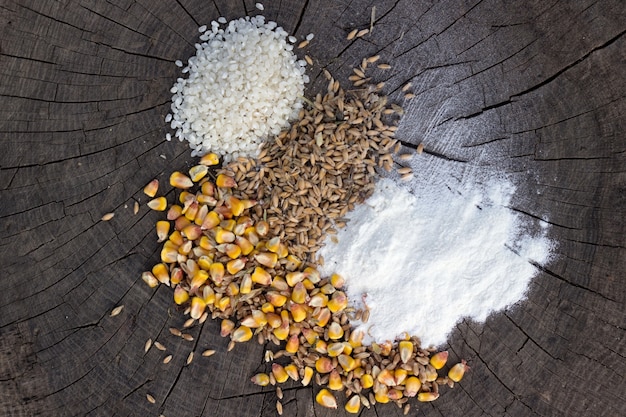 Grains food mix on wooden background