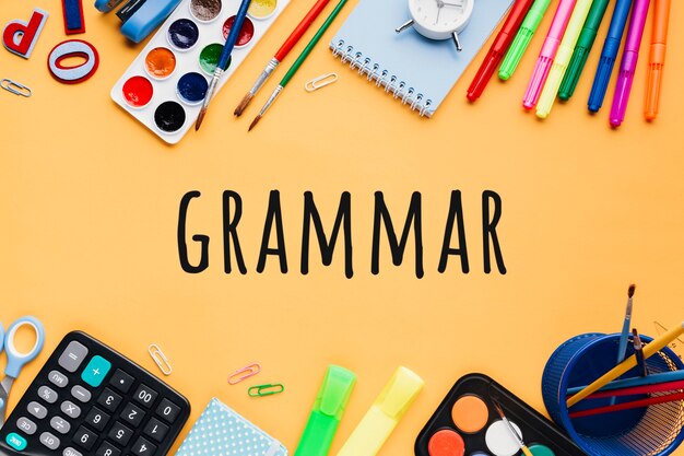 Grammar background with school supplies