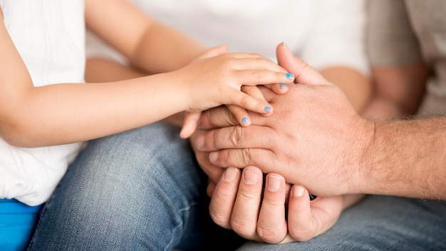 Granddaughter and grandfather holding hands