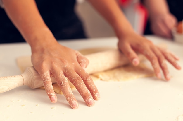 Granddaughter knead dough on christmas day