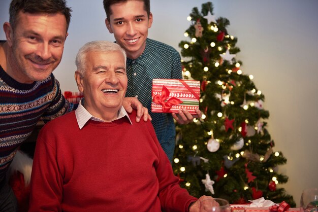 Grandfather, son and grandson on one photography