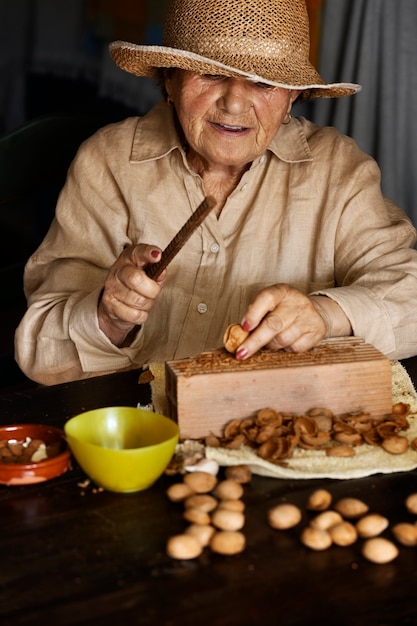 Grandma cracking wallnuts