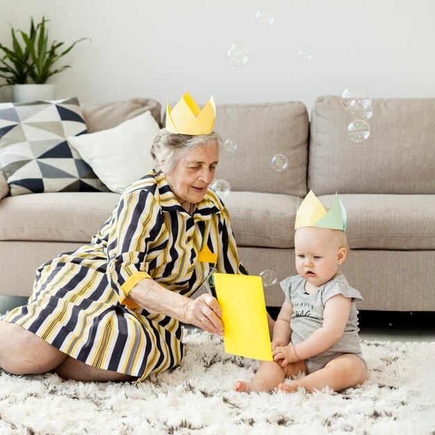 Grandma in elegant dress playing with grandchild