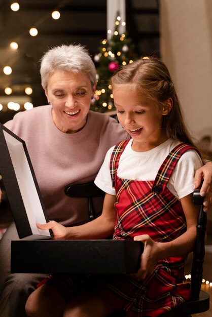 Grandmother and grand daughter enjoying a festive christmas dinner