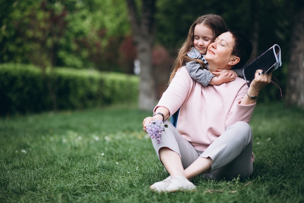 Free photo grandmother and grandchild in park