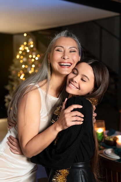 Grandmother and granddaughter enjoying a new year party