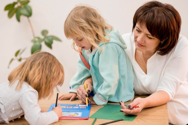 Grandmother and granddaughters playing together