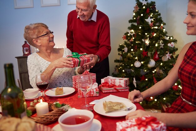 Grandmother receiving a gift from her husband