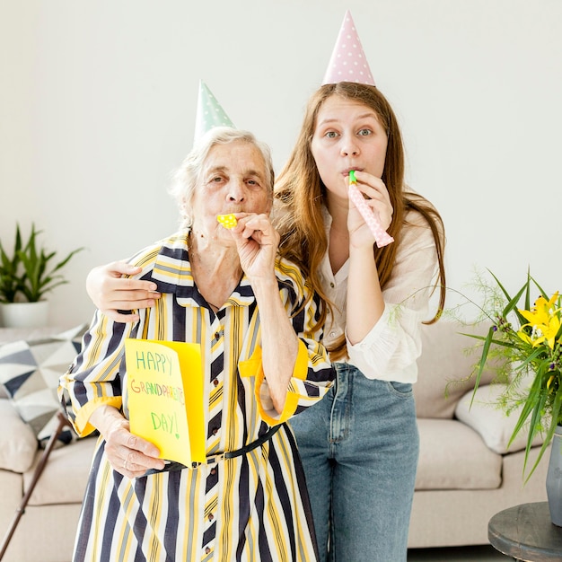 Free photo grandmother spending quality time with family