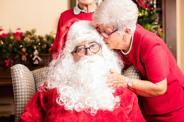 Grandmother talking to santa claus on christmas