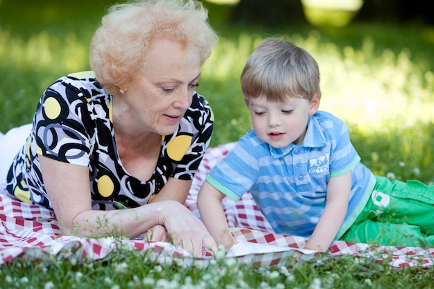 Grandmother with her grandson in the park