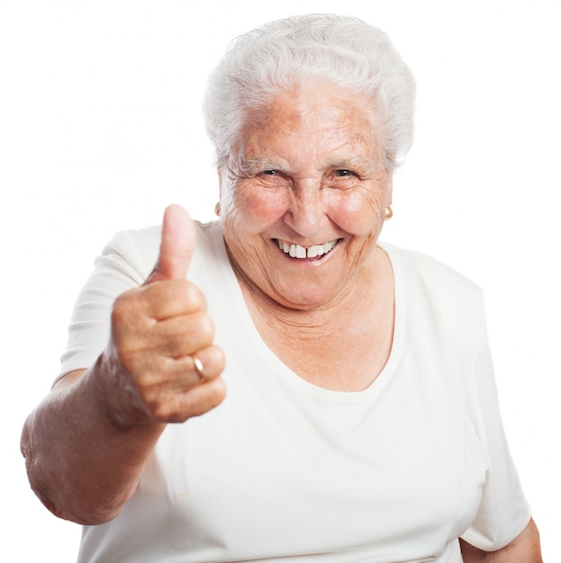 Free photo grandmother with a raised thumb
