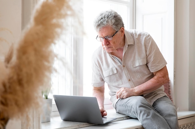 Grandparent learning to use digital device