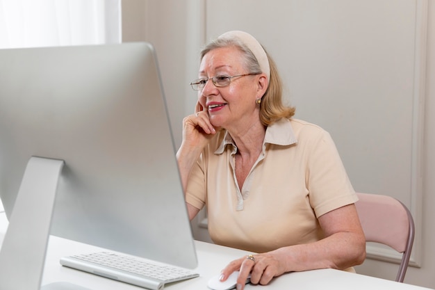 Grandparent learning to use digital device