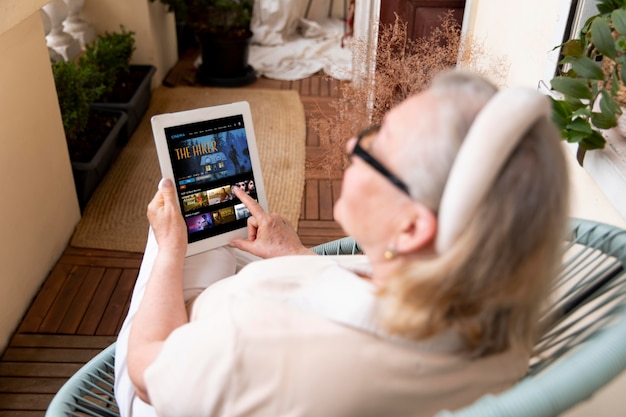 Grandparent learning to use digital device