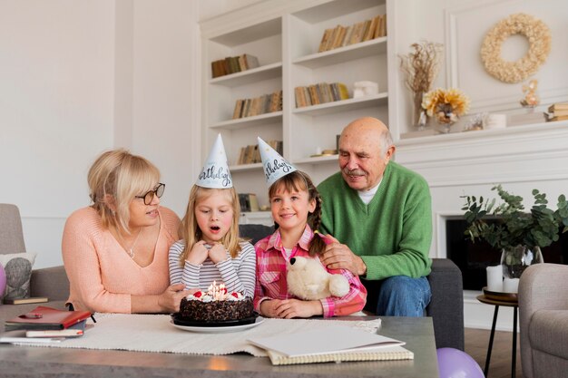 Grandparents and granddaughters  indoors