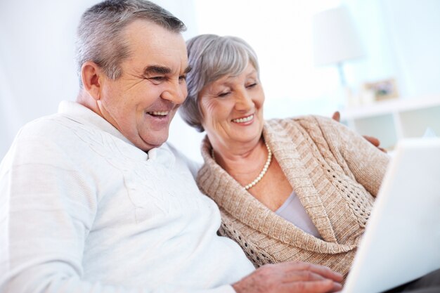 Grandparents using laptop