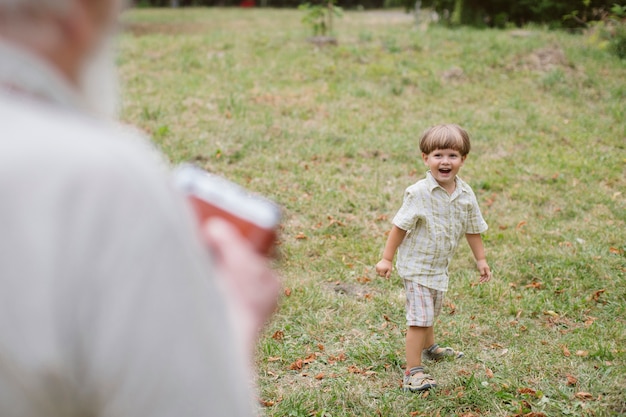 Grandson smiling for camera outdoor