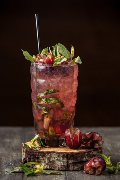 grape juice with grape slices, ice cubes and mint leaves