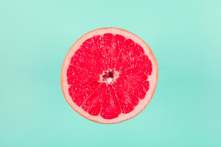 Free Photo grapefruit citrus fruit on pastel background