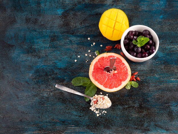 Grapefruit with oatmeal and berries in bowl 