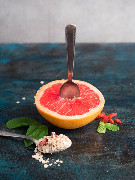 Grapefruit with oatmeal on blue table