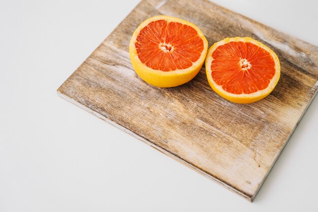 Grapefruit on wooden board