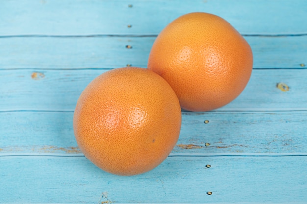 Grapefruits on a rustic blue wooden table