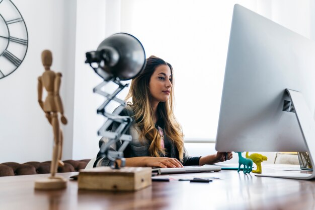 Graphic designer sitting at desk