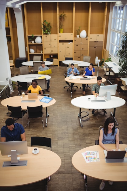 Free photo graphic designers working at their desk