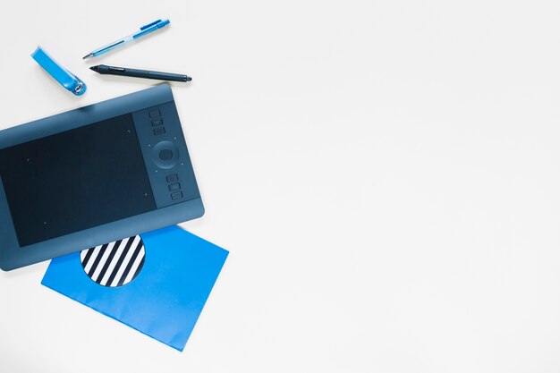 graphic digital tablet and stationeries on white background