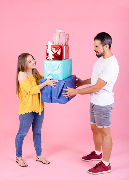 Grateful businesswoman taking gifts from her boyfriend