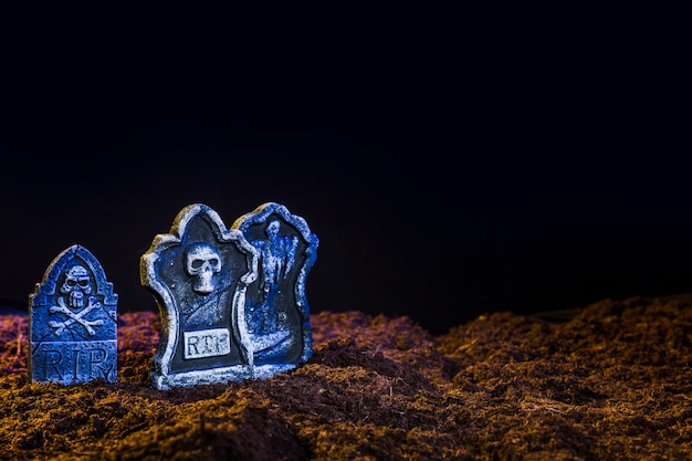 Gravestones with blueness on maroon ground