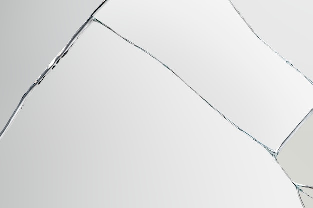 Free photo gray background with cracked glass texture