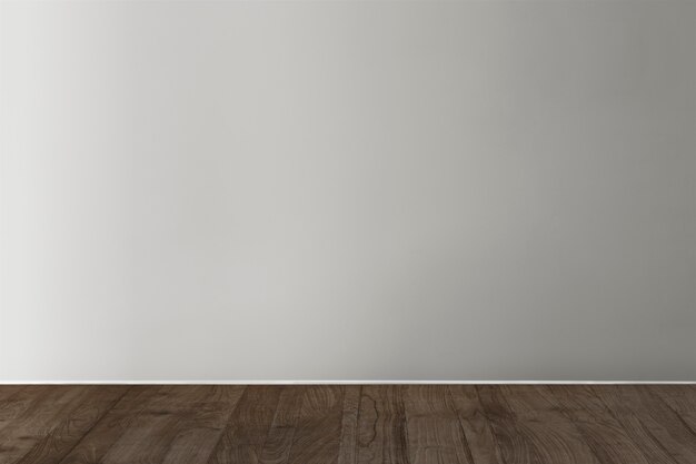 Gray blank concrete wall mockup with a wooden floor