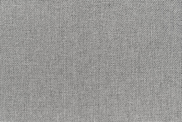 灰色の布の布のテクスチャの抽象的な背景家具の張り
