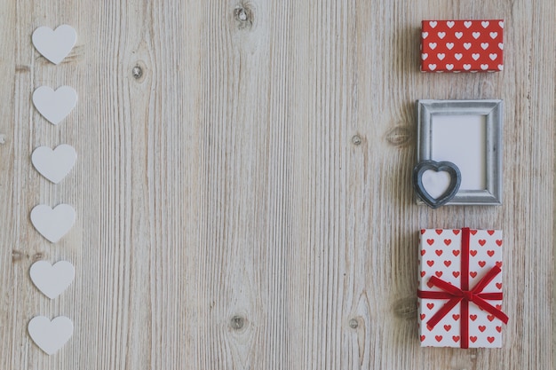 Gray frame with two gifts and white hearts