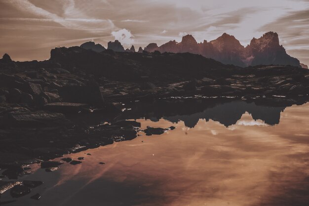 Gray Mountains Near Body of Water