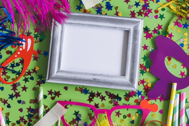 Gray photo frame with confetti and colorful glasses