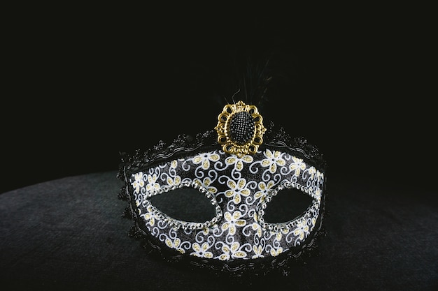 Gray venetian mask on a dark background